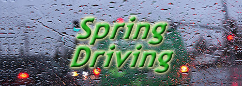 Spring Driving - rainy windshield with vehicle tail lights